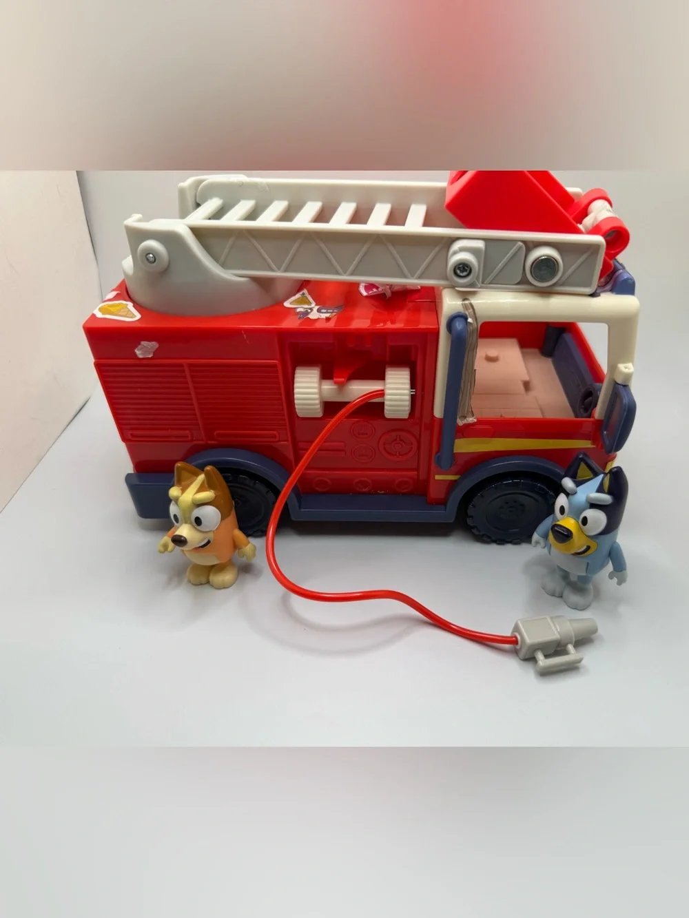 Disney Bluey fire truck playset toy with bingo bluey figure
